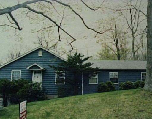 2 Ash Swamp Road Washington, CT 06777 - Photo 1 of 1 a front view of a house with a garden