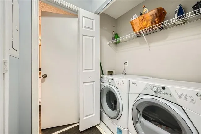 a view of a hallway with washer and dryer