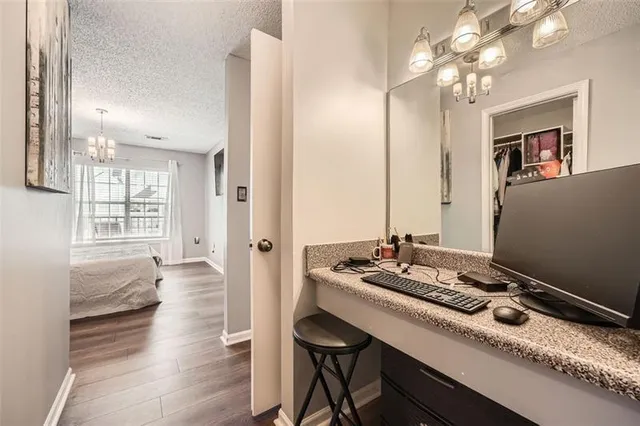 a room with a table chairs and entryway