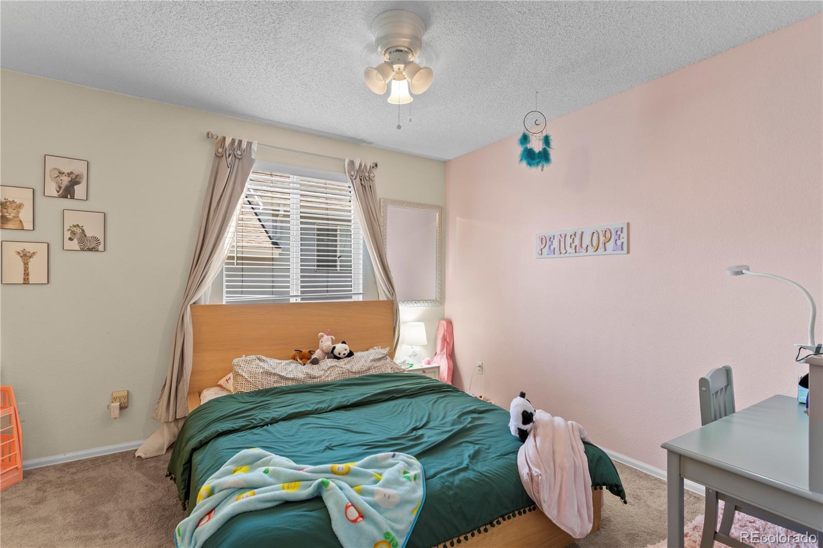 2212 Hyacinth Road Littleton, CO 80129 - Photo 29 of 44 a bedroom with a bed and a window