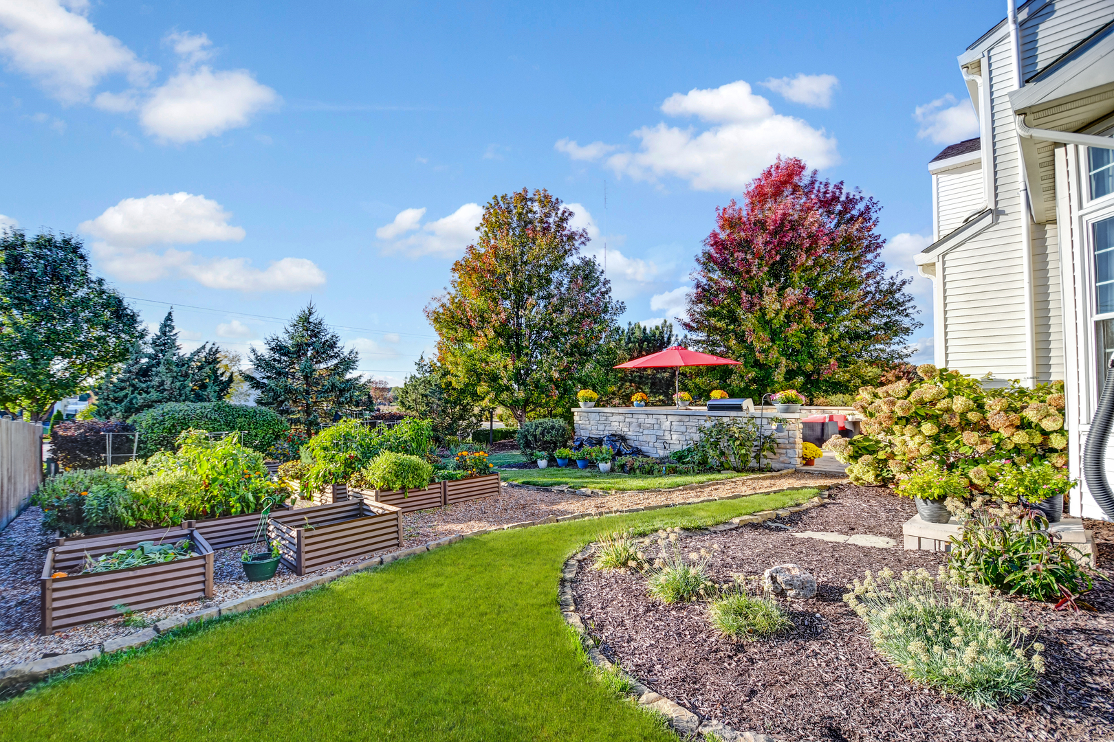 25758 South Basswood Road Channahon, IL 60410 - Photo 39 of 42 a view of a house with a yard and a garden