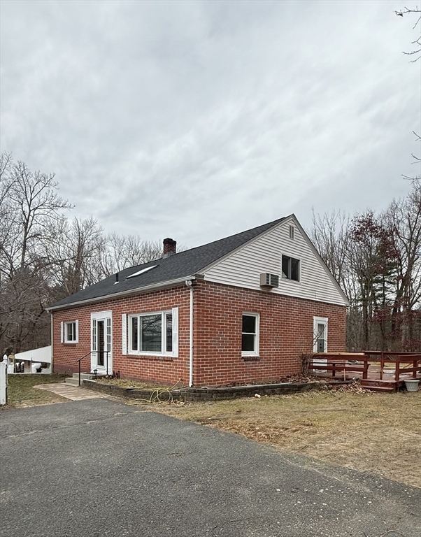 371 Wilbraham Street, Unit 1 Palmer, MA 01069 - Photo 18 of 21 a view of a yard in front of a house