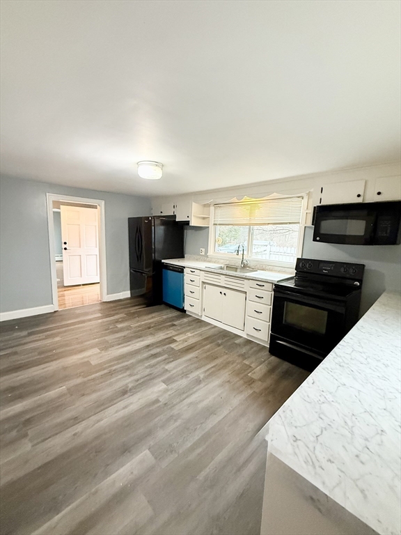 371 Wilbraham Street, Unit 1 Palmer, MA 01069 - Photo 2 of 21 a view of kitchen with wooden floor