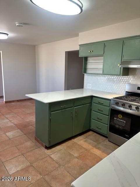 1705 6th Green Street Douglas, AZ 85607 - Photo 4 of 17 a kitchen with a cabinets and a stove top oven