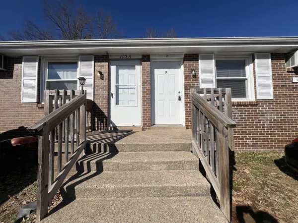 a view of entryway with a front door