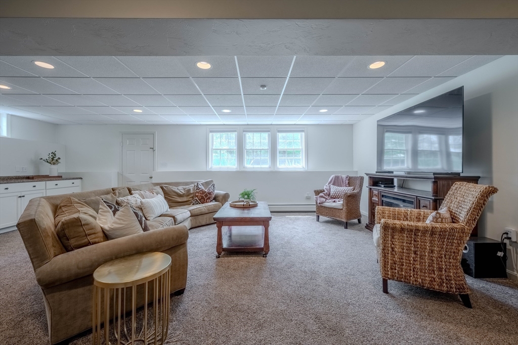 18 Dominitis Drive Holden, MA 01522 - Photo 25 of 41 a living room with furniture and a large window