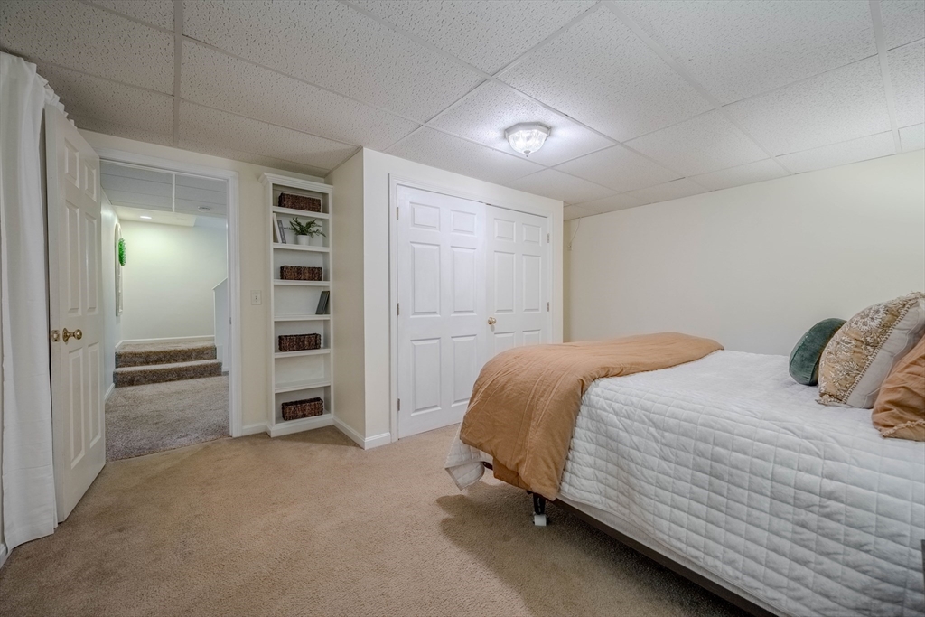 18 Dominitis Drive Holden, MA 01522 - Photo 27 of 41 a bedroom with a bed and walk in closet