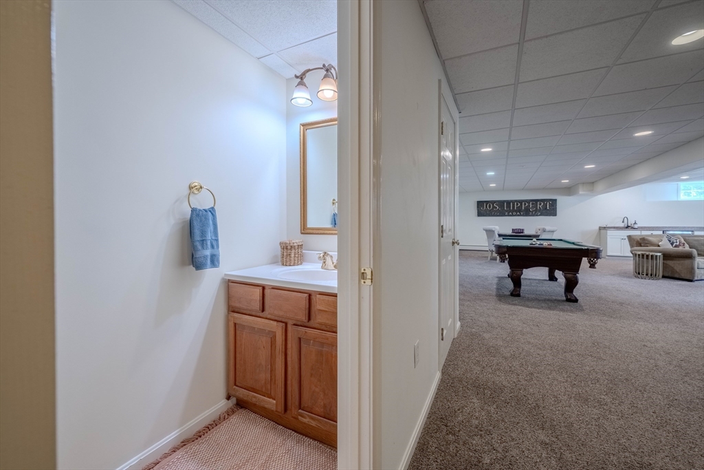 18 Dominitis Drive Holden, MA 01522 - Photo 32 of 41 a view of a hallway with cabinet and a bathroom
