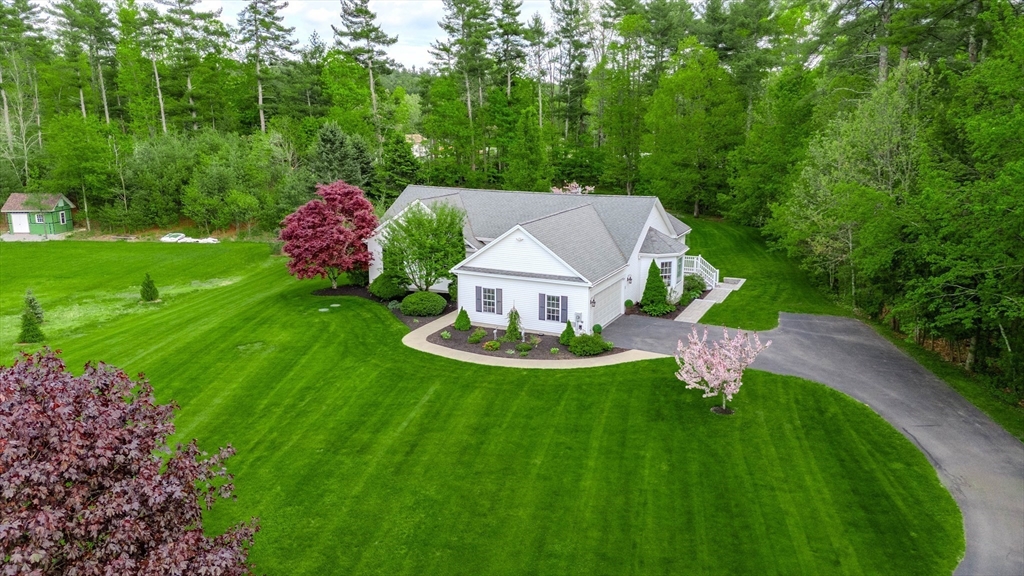 18 Dominitis Drive Holden, MA 01522 - Photo 36 of 41 a view of a house with a yard table and chairs