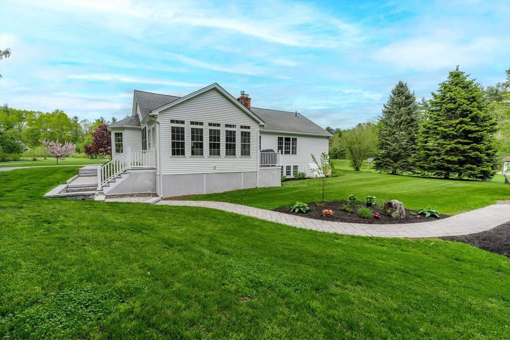 18 Dominitis Drive Holden, MA 01522 - Photo 37 of 41 a view of a house with a yard and potted plants