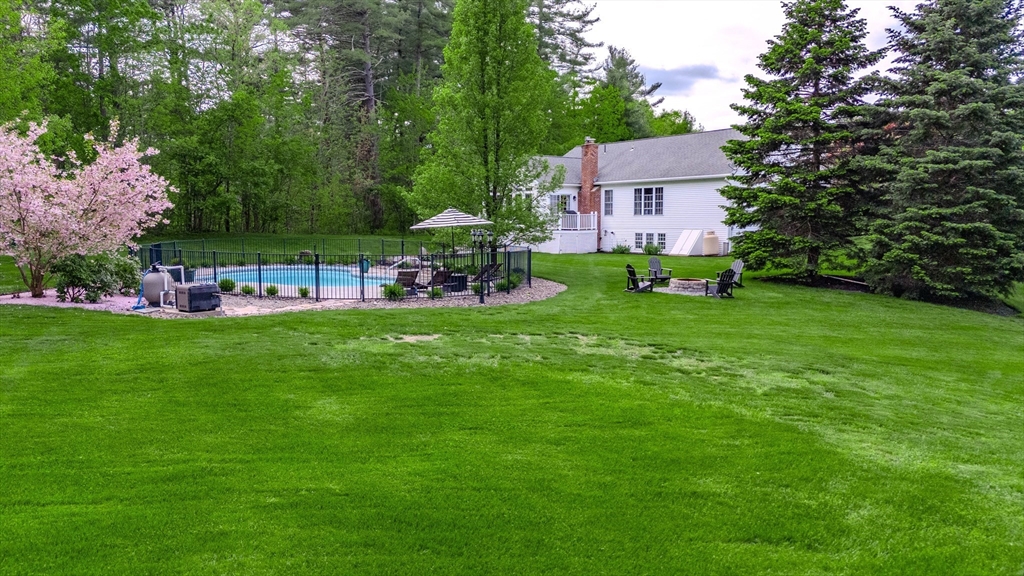 18 Dominitis Drive Holden, MA 01522 - Photo 40 of 41 a view of a house with a yard and sitting area