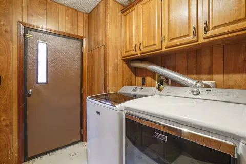 a spacious bedroom with a bed and ceiling fan