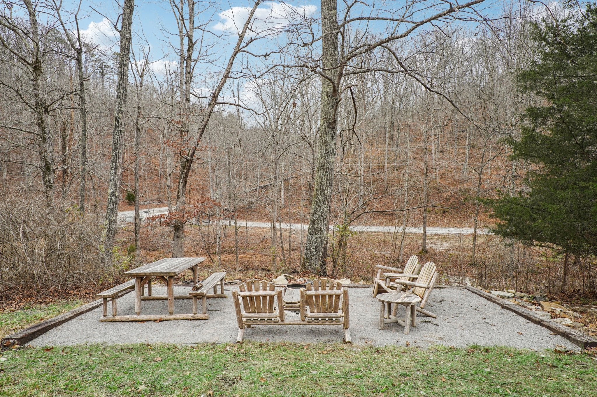 3668 Old Sams Creek Road Pegram, TN 37143 - Photo 36 of 60 a view of a bench sitting in a backyard