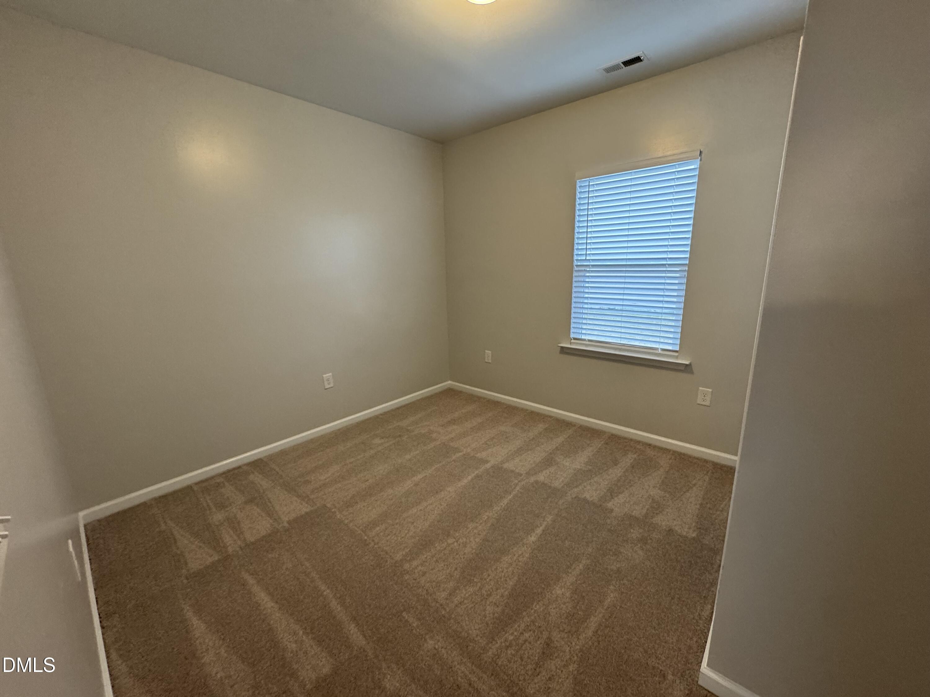 2022 Attend Crossing Fuquay-Varina, NC 27526 - Photo 14 of 43 a view of an empty room with a window