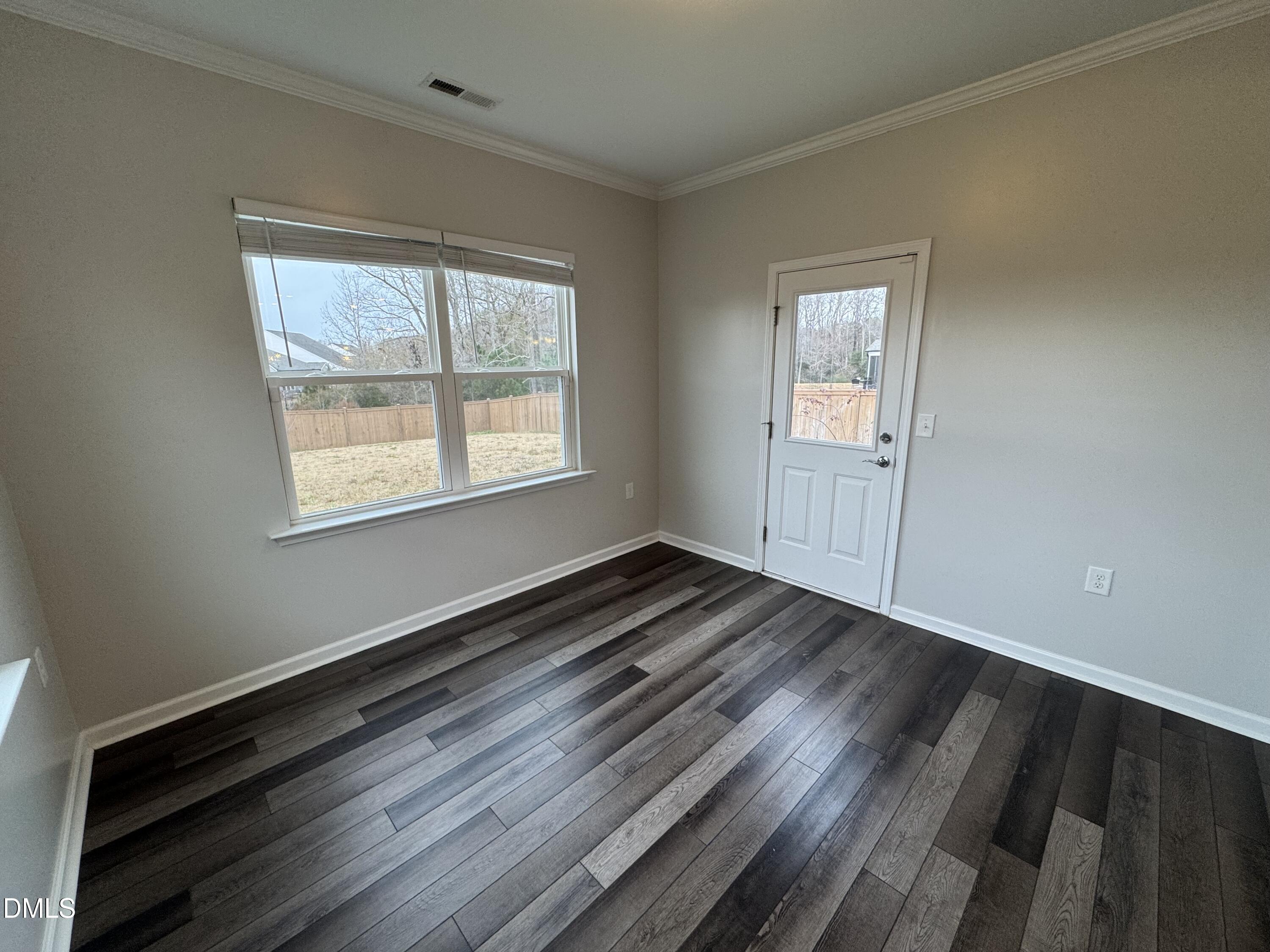 2022 Attend Crossing Fuquay-Varina, NC 27526 - Photo 17 of 43 a view of an empty room and wooden floor