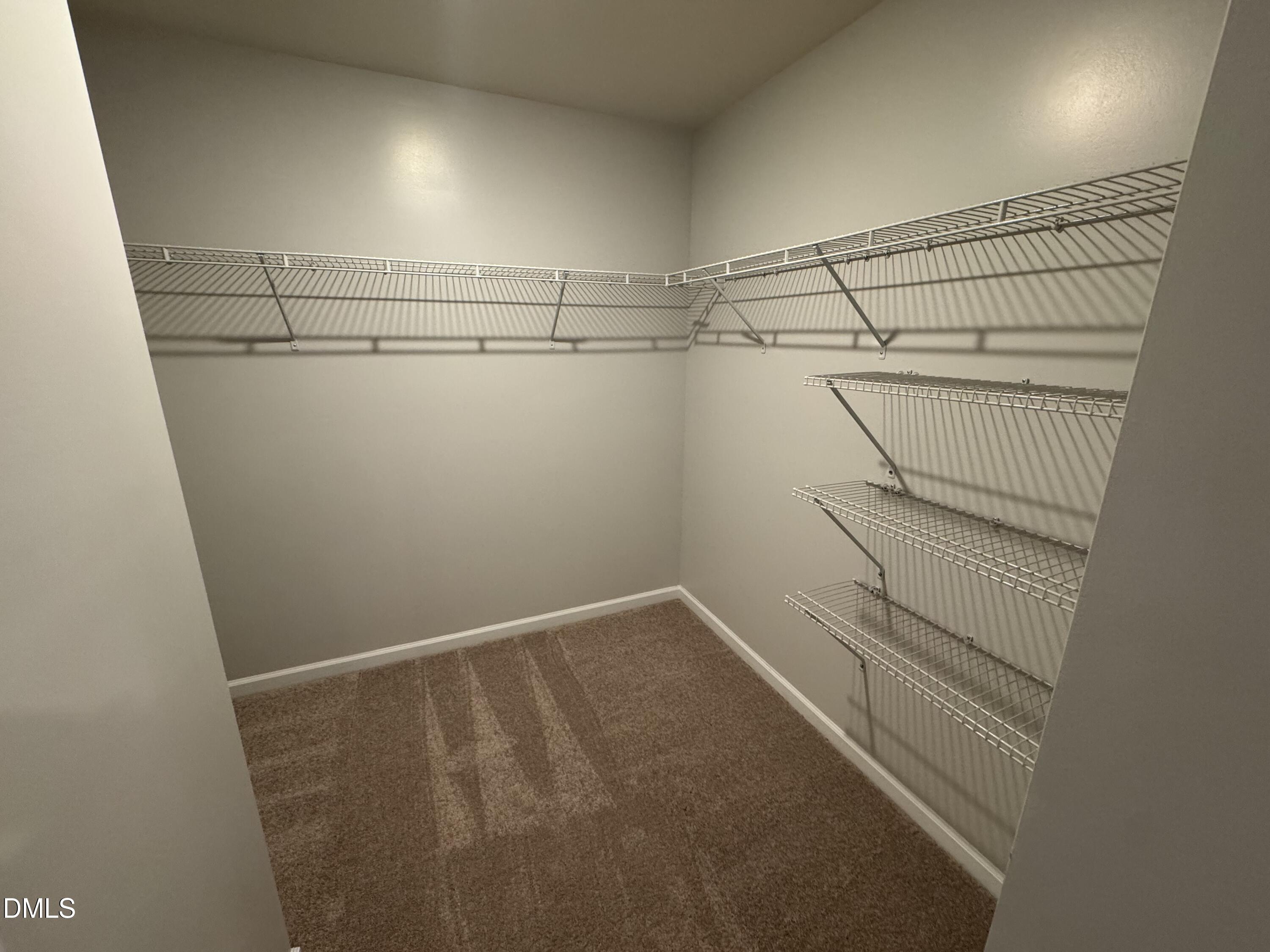 2022 Attend Crossing Fuquay-Varina, NC 27526 - Photo 20 of 43 a view of a room with racks on the wall