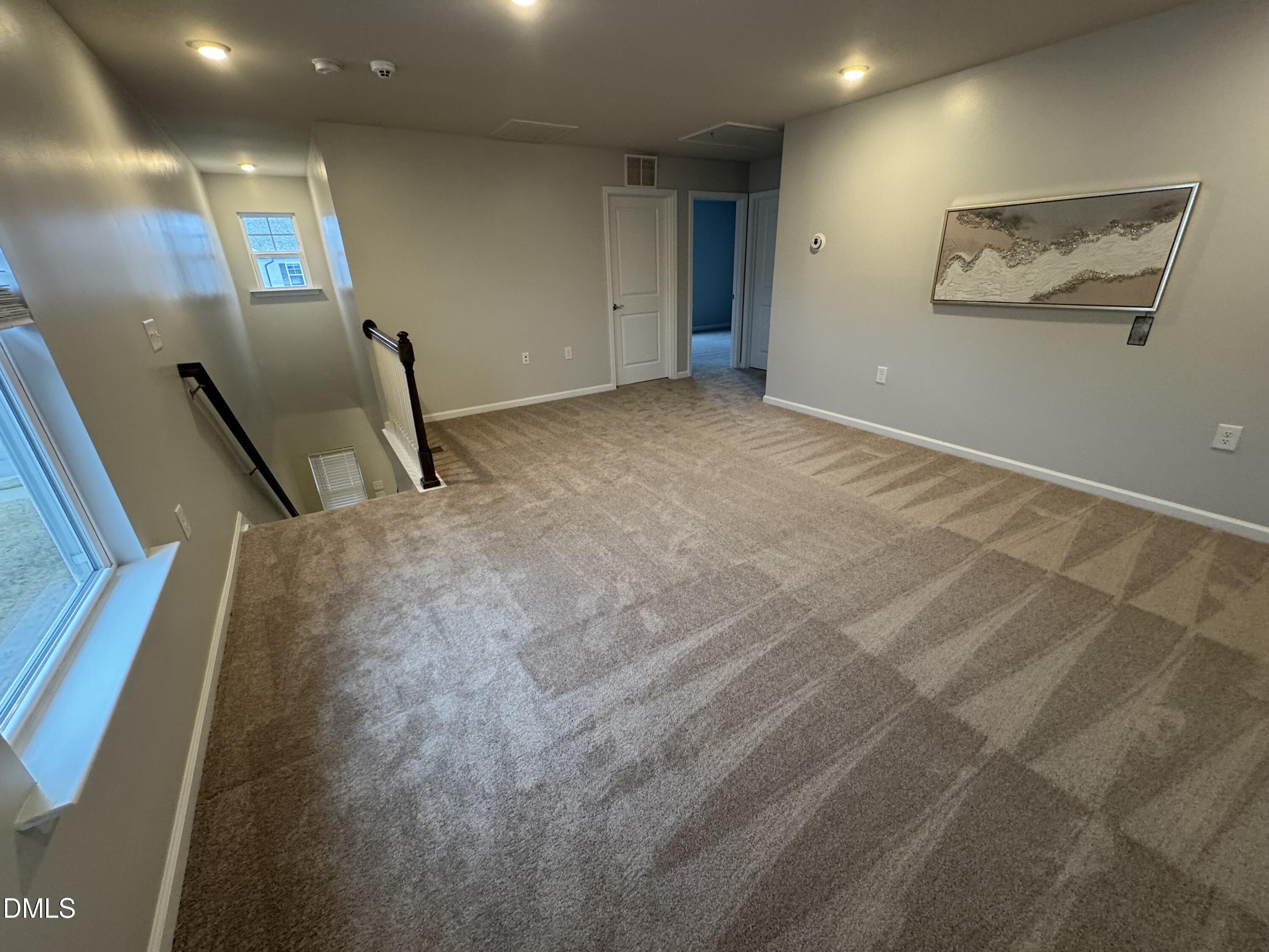 2022 Attend Crossing Fuquay-Varina, NC 27526 - Photo 28 of 43 a view of a hallway with stairs