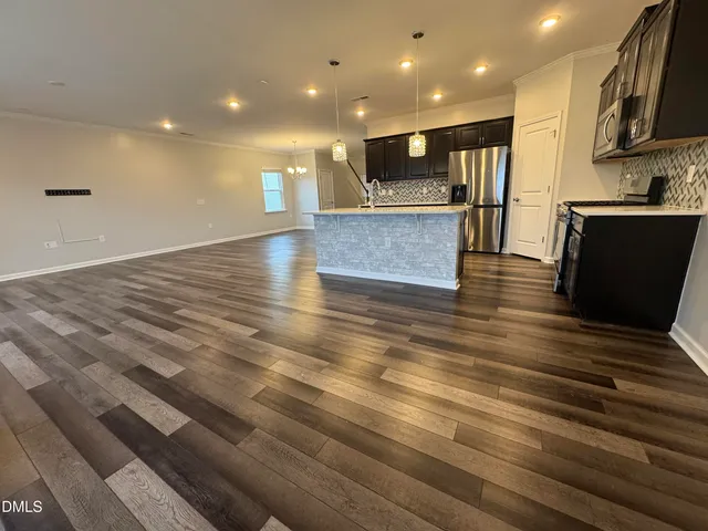 a stove top oven sitting inside of a kitchen
