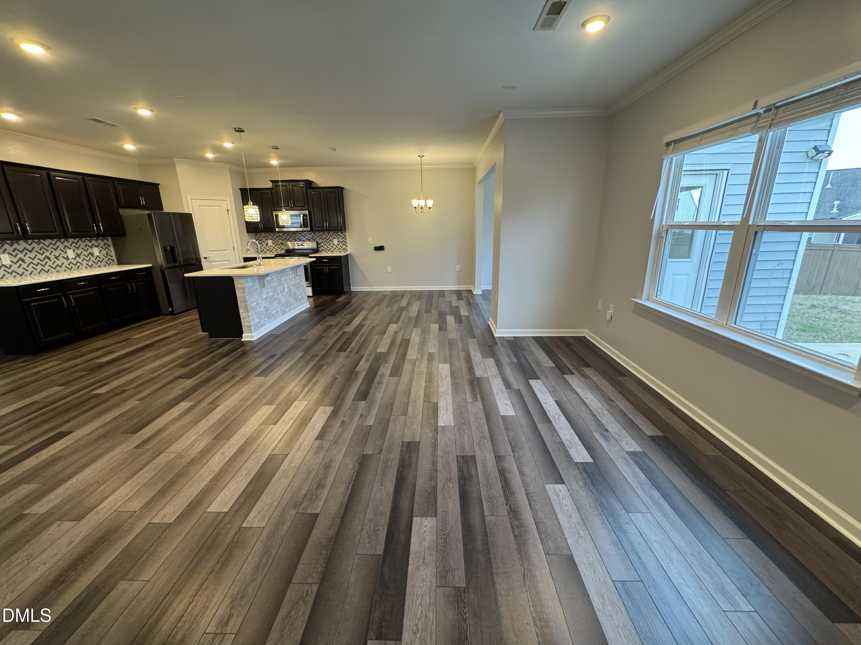 2022 Attend Crossing Fuquay-Varina, NC 27526 - Photo 10 of 43 a view of kitchen with sink and wooden floor