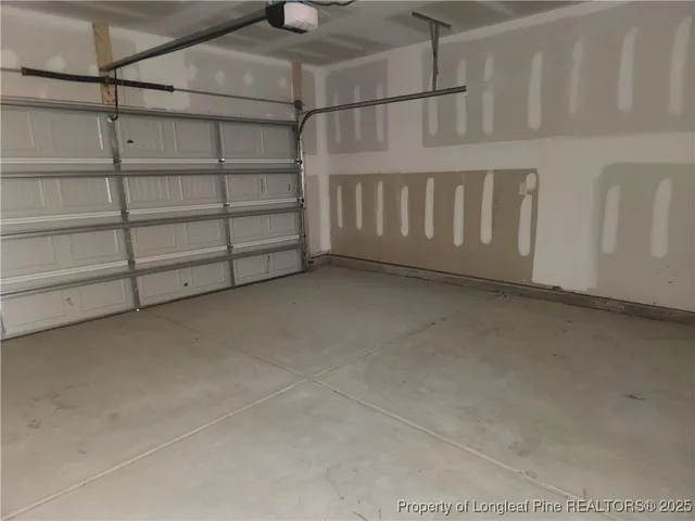 a view of an empty room with a staircase