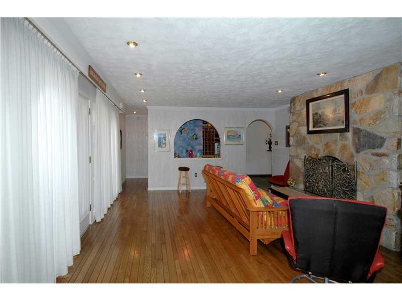 324 McIntyre Road Pittsburgh, PA 15237 - Photo 10 of 25 Family Room. Another great room located right off of the kitchen and leading to the amazing patio! Notice the beautiful fireplace, hardwood floors and a wetbar, completing your entertainment checklist
