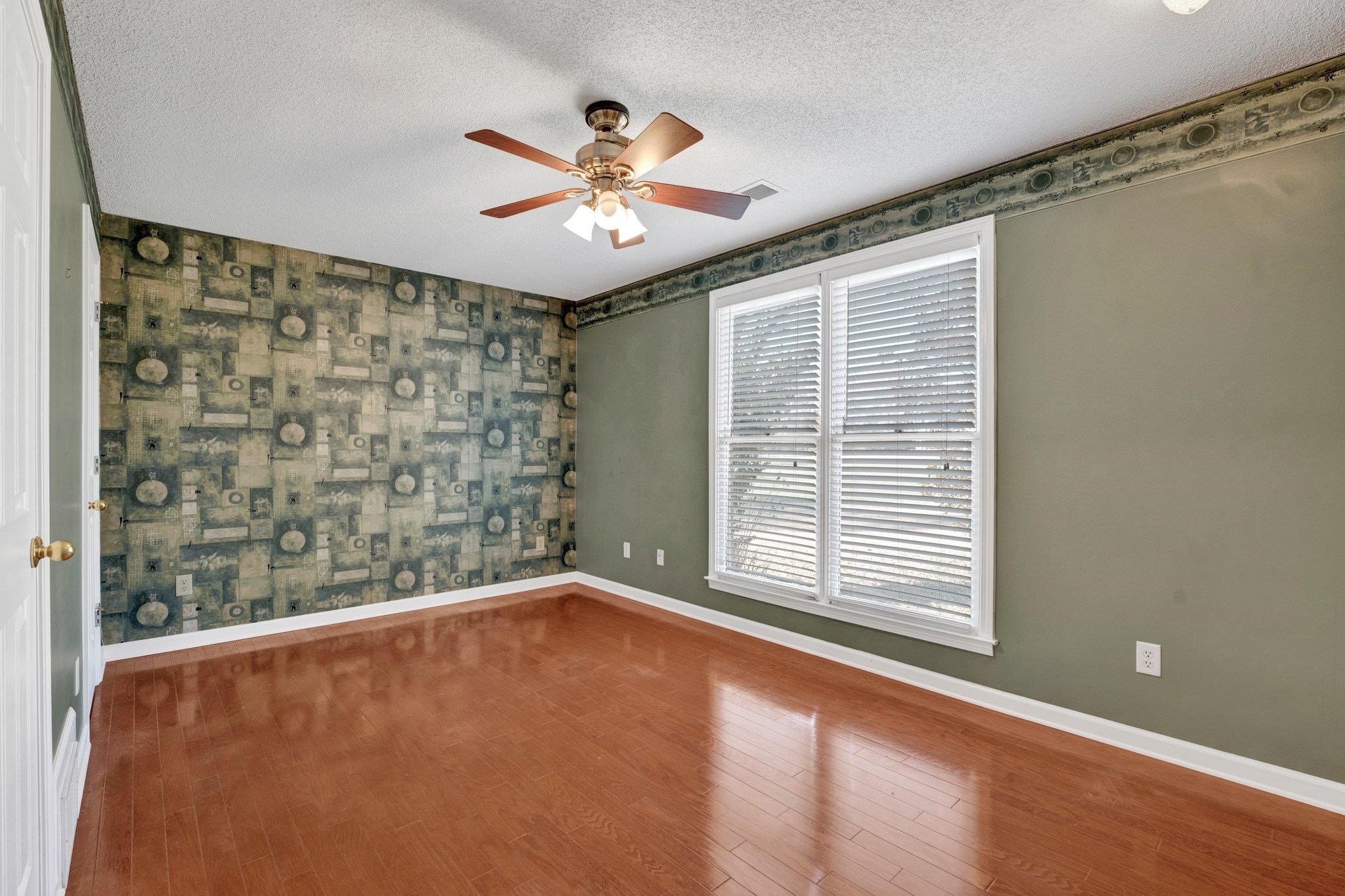 6150 Ricks Road Arlington, TN 38002 - Photo 29 of 40 Empty room featuring ceiling fan, wood-type flooring, and a textured ceiling