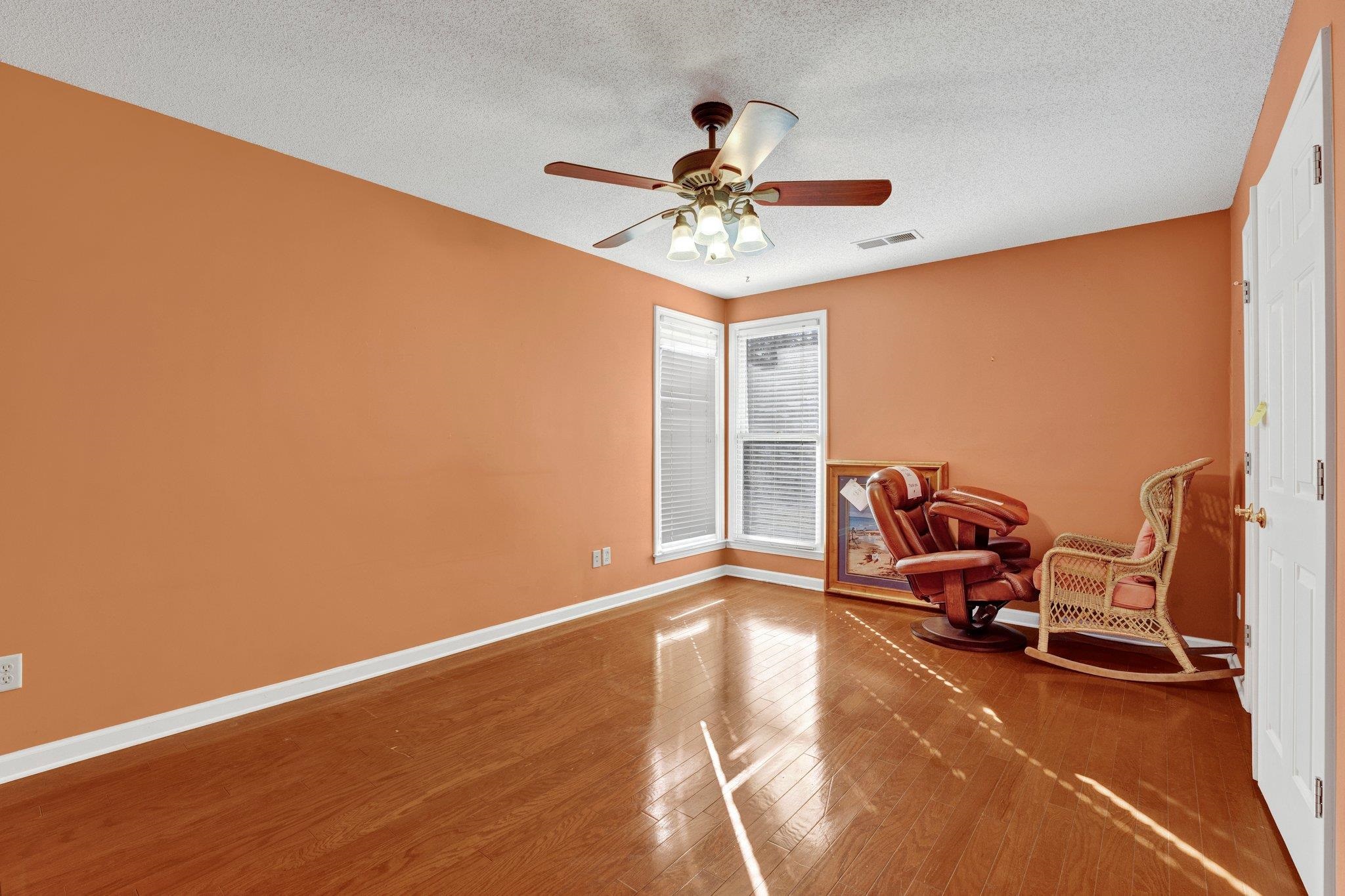 6150 Ricks Road Arlington, TN 38002 - Photo 32 of 40 Unfurnished room with hardwood / wood-style flooring, ceiling fan, and a textured ceiling
