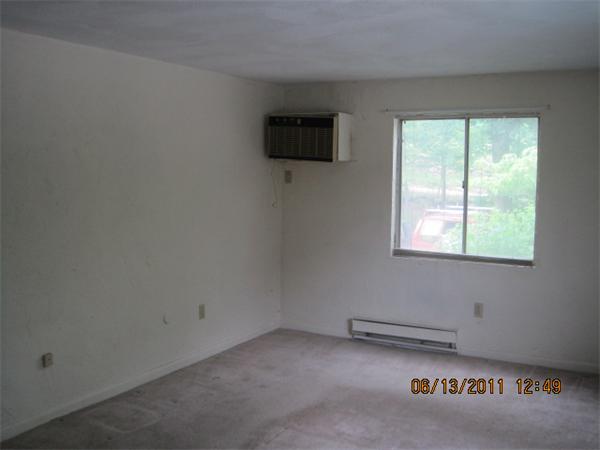 232 Swanson Road, Unit 631 Boxborough, MA 01719 - Photo 3 of 7 an empty room with a window