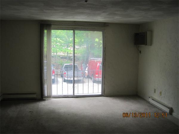 232 Swanson Road, Unit 631 Boxborough, MA 01719 - Photo 5 of 7 a view of empty room with floor to ceiling window