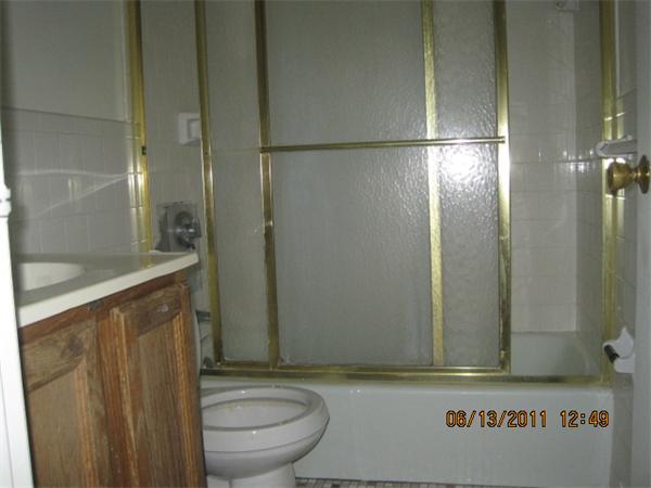 232 Swanson Road, Unit 631 Boxborough, MA 01719 - Photo 7 of 7 a bathroom with a granite countertop sink toilet and shower