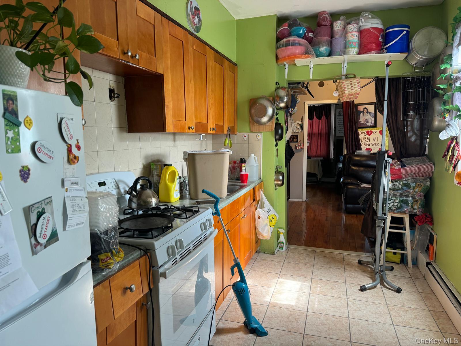 45-16 National Street Queens, NY 11368 - Photo 20 of 28 a utility room with lots of clutter and cabinets
