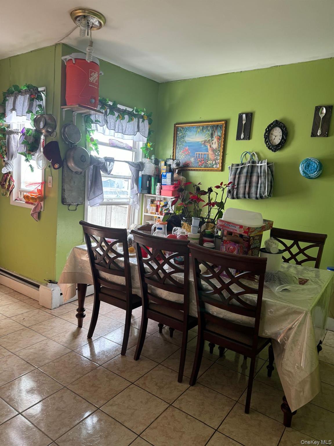 45-16 National Street Queens, NY 11368 - Photo 21 of 28 a view of a dining room with furniture and chandelier
