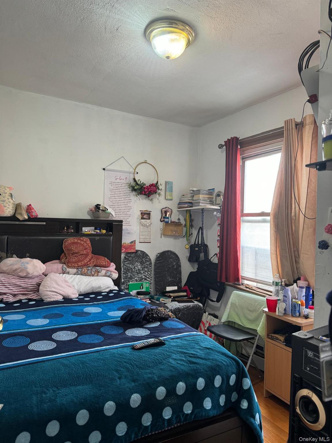 45-16 National Street Queens, NY 11368 - Photo 22 of 28 a bedroom with bed and a window