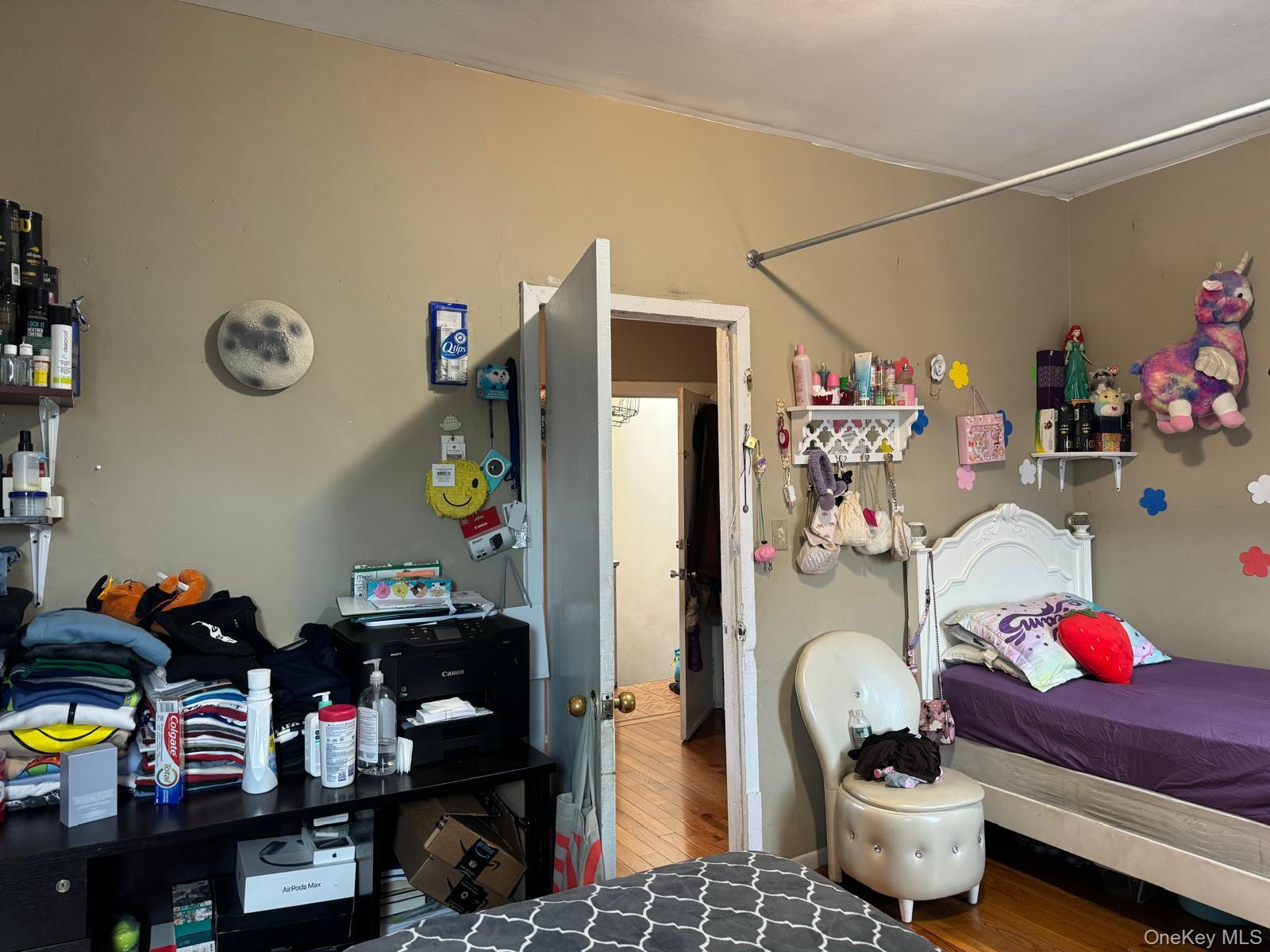45-16 National Street Queens, NY 11368 - Photo 24 of 28 a living room with lots of furniture and clutter
