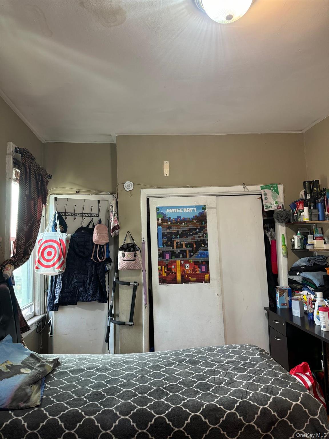 45-16 National Street Queens, NY 11368 - Photo 27 of 28 a bedroom with a bed and a couch