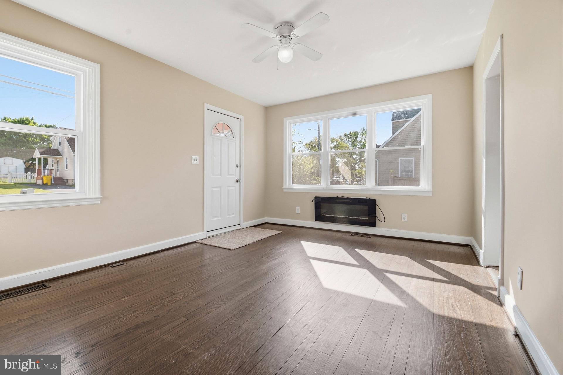 8444 Garden Road Pasadena, MD 21122 - Photo 4 of 28 LIVING ROOM -HARDWOOD FLOORS
