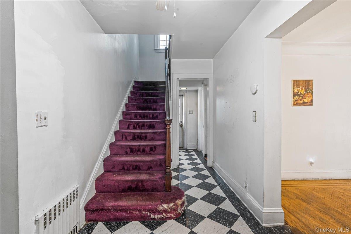180-19 Grand Central Parkway Queens, NY 11432 - Photo 12 of 28 a view of entryway with wooden floor