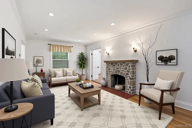 a living room with furniture and a fireplace