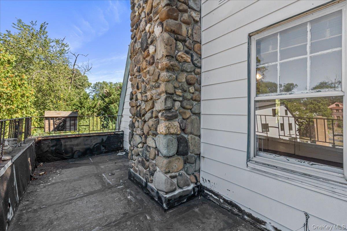 180-19 Grand Central Parkway Queens, NY 11432 - Photo 21 of 28 a view of a bench in the backyard