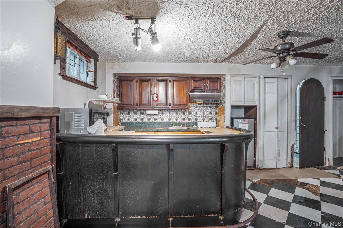 180-19 Grand Central Parkway Queens, NY 11432 - Photo 24 of 28 a kitchen with a sink and cabinets