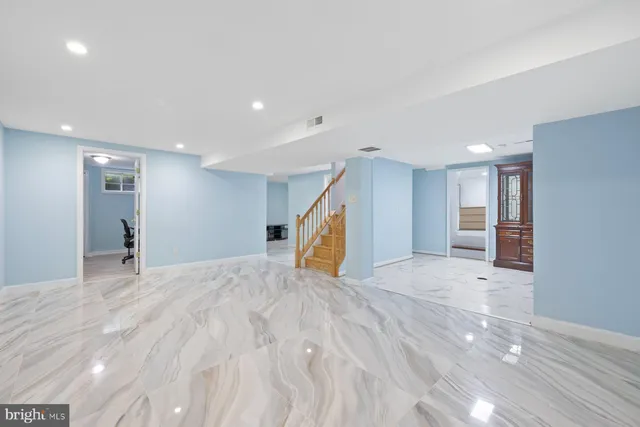 a view of a livingroom with a staircase
