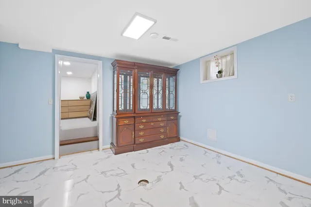 a view of an empty room and window