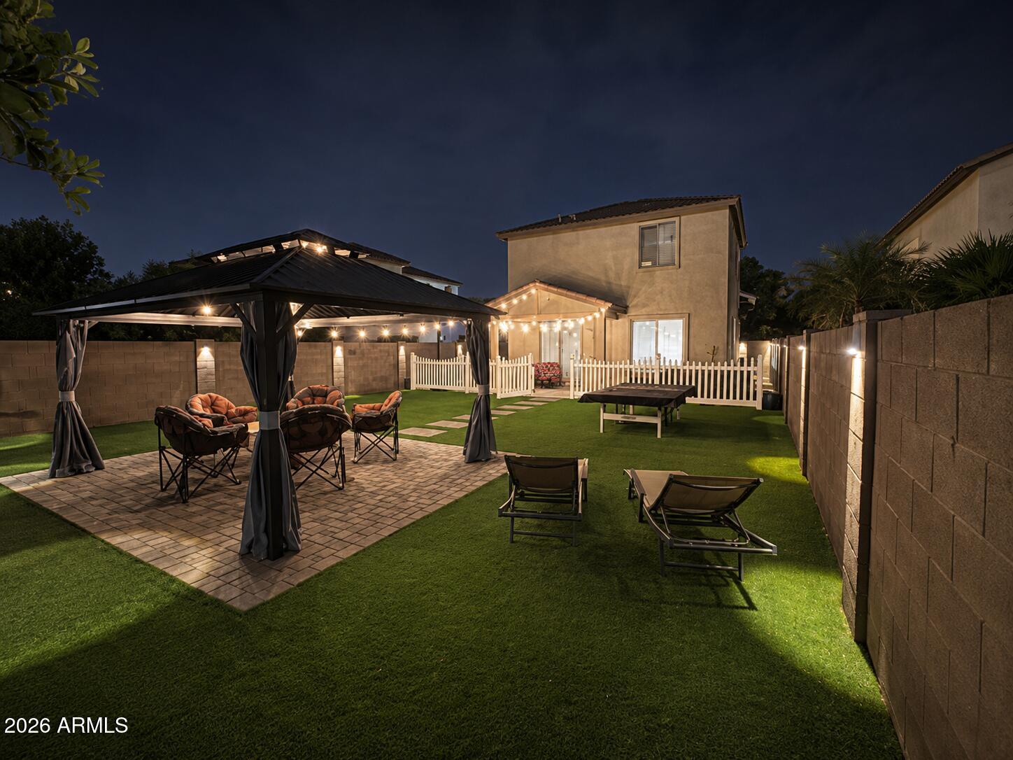 4184 East Trigger Way Gilbert, AZ 85297 - Photo 2 of 51 a view of a house with backyard porch and sitting area