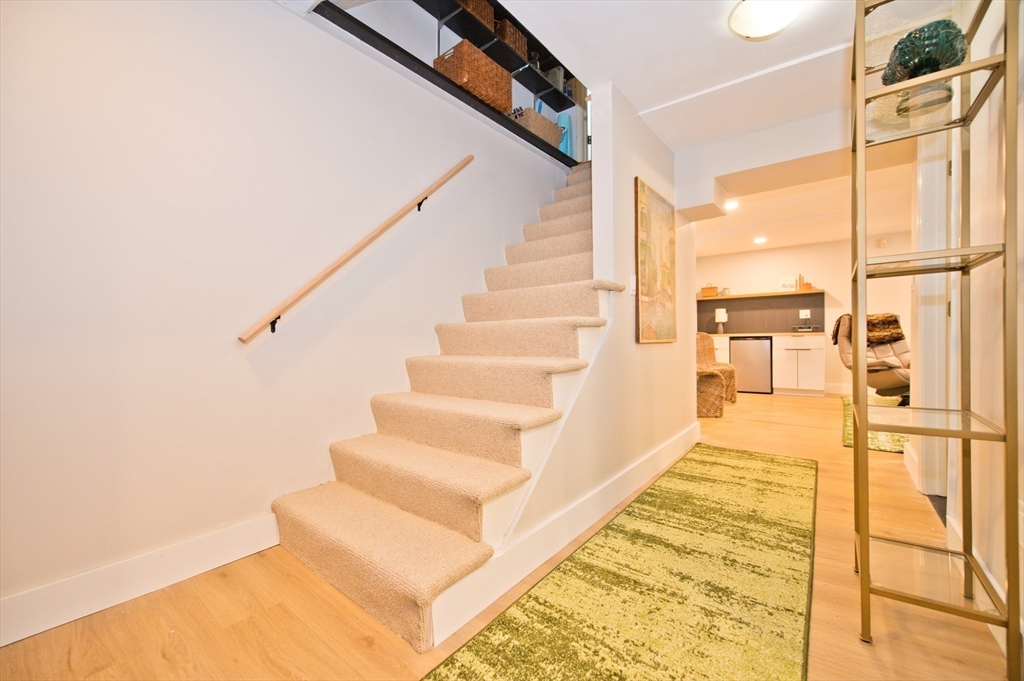 16 Warren Avenue Newton, MA 02465 - Photo 23 of 42 a view of entryway and hall with wooden floor