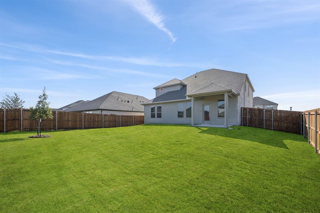 2313 Wind River Road Princeton, TX 75407 - Photo 33 of 35 Covered Patio in the Masters home plan by Trophy Signature Homes – REPRESENTATIVE PHOTO