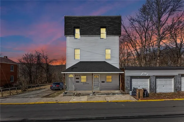 a view of house with yard