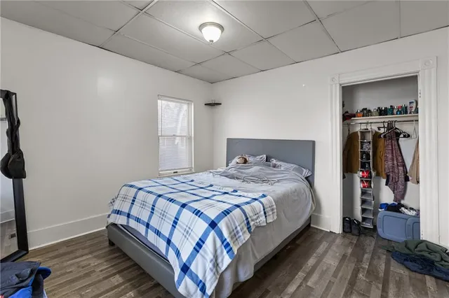 a bedroom with a bed and a walk in closet
