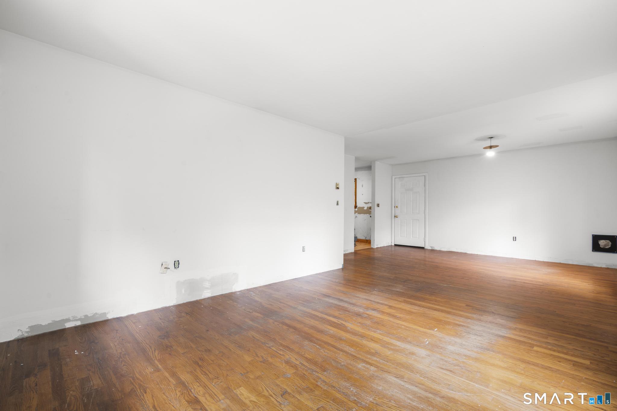 292 Branch Road Thomaston, CT 06787 - Photo 30 of 32 Upper level LR / DR space in need of trim to finish space. Could be in-law space, rental endless possibilities.