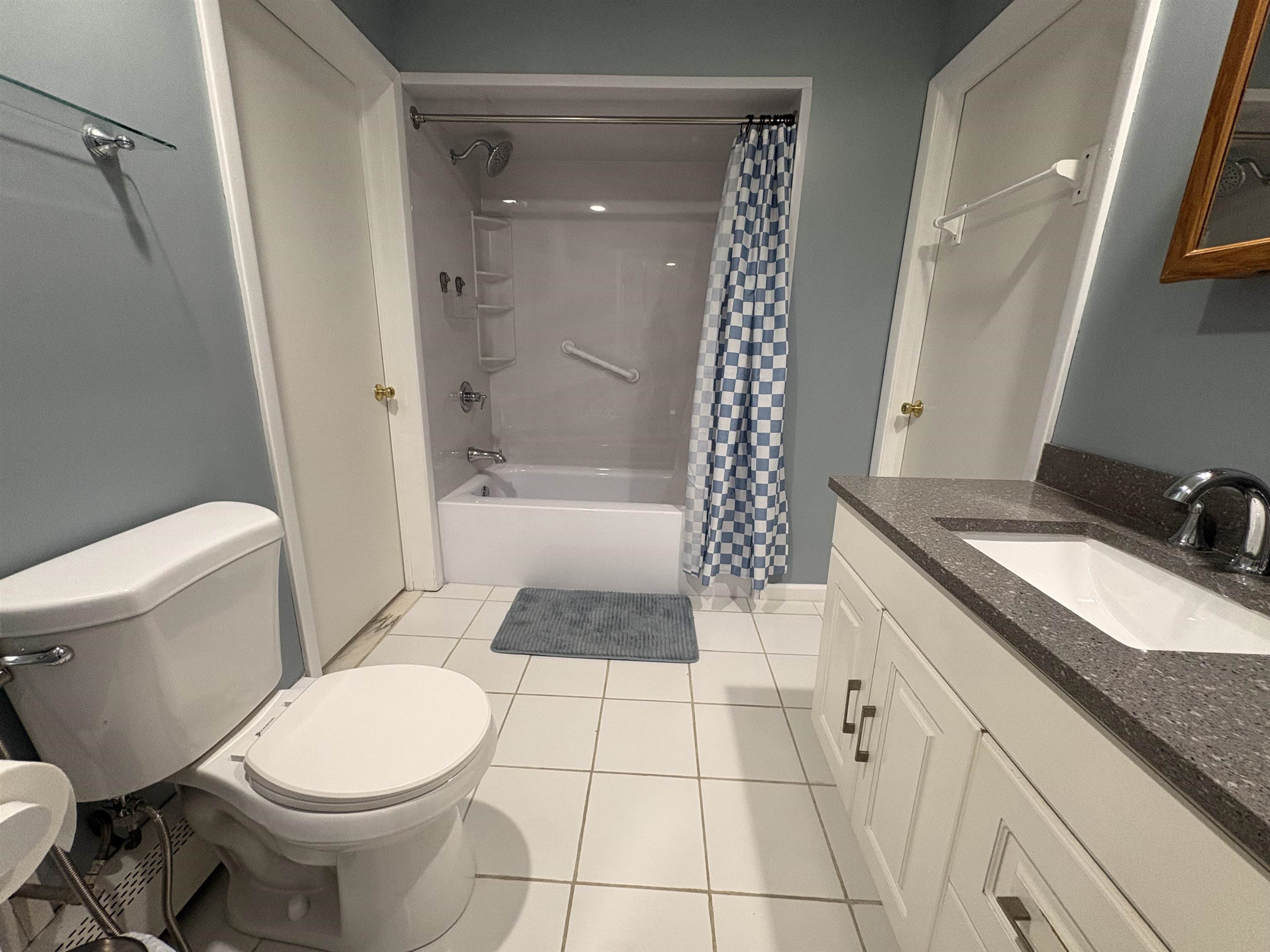 32 Franklin Street, Unit 2 Hackensack, NJ 07601 - Photo 9 of 13 a bathroom with a granite countertop toilet sink and shower