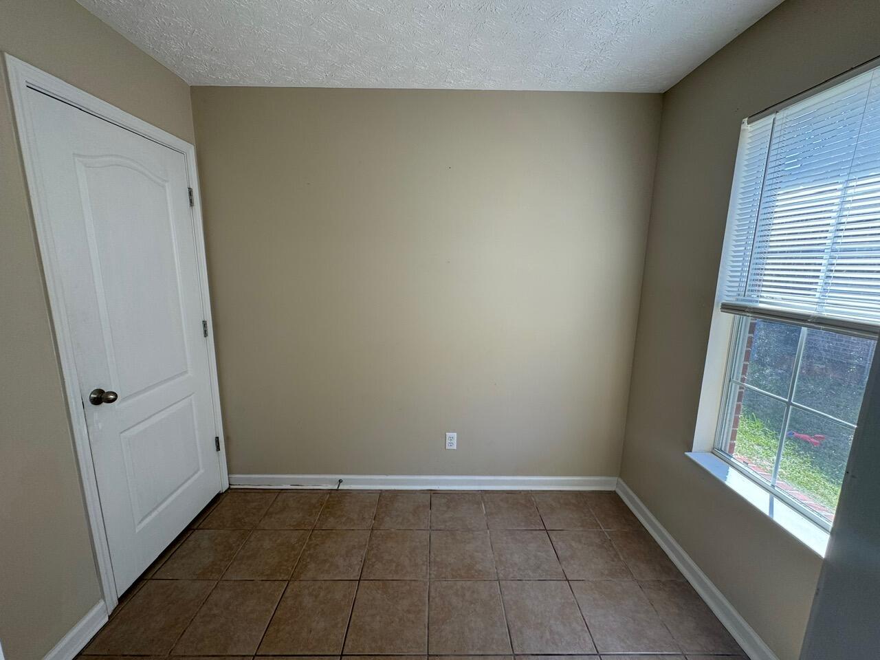 225 Bay Grove Road Freeport, FL 32439 - Photo 17 of 33 a view of an empty room with a window